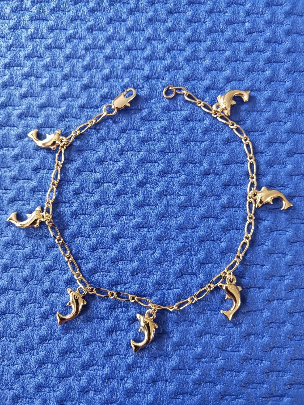 Dolphin 7 Charm Gold Tone Bracelet